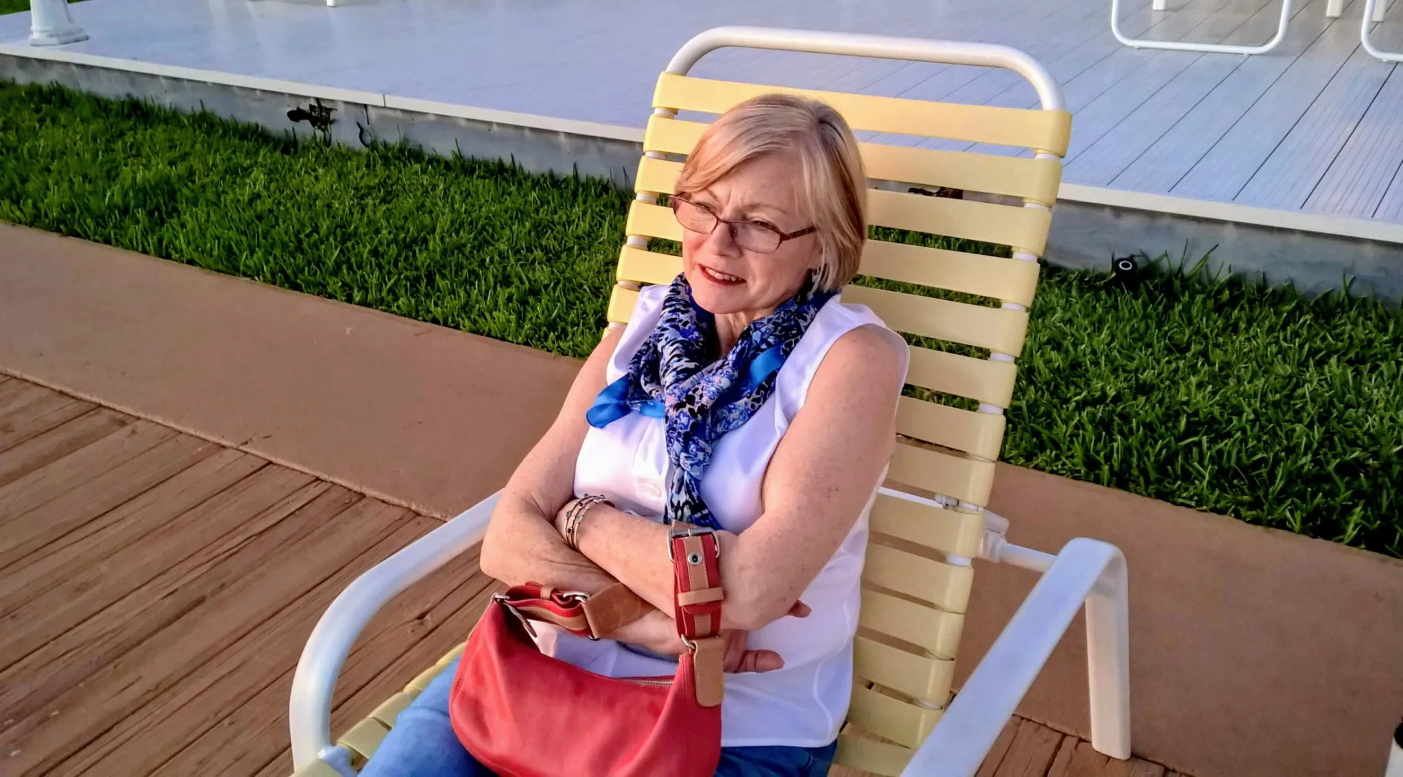 Suzanne resting in a lounge chair at sunset